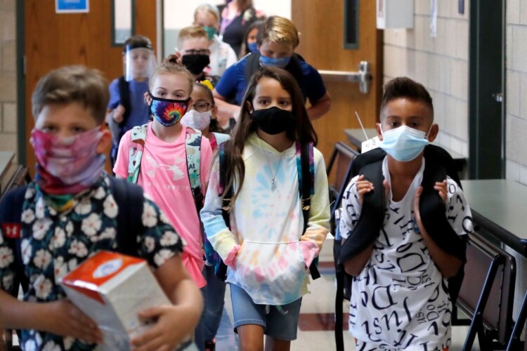 Masked students in elementary school during the COVID-19 pandemic.