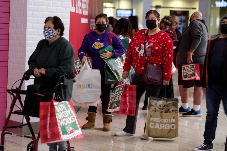 Masked shoppers waiting in line during Black Friday 2021