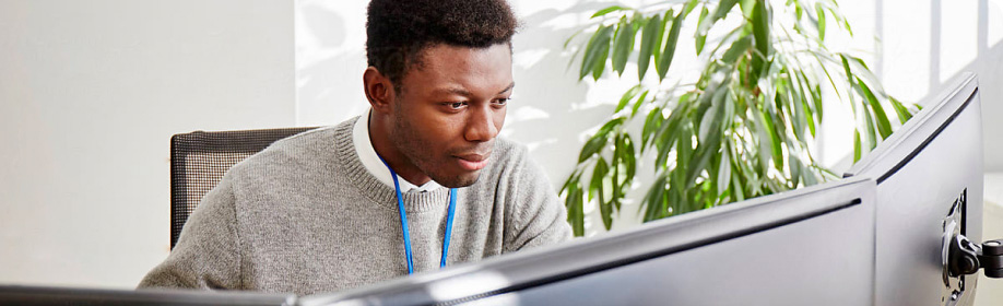 Black man at a computer