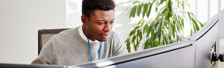 Black man at a computer