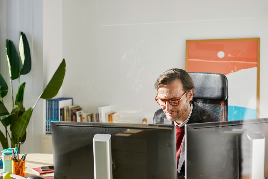 A man at his computer working